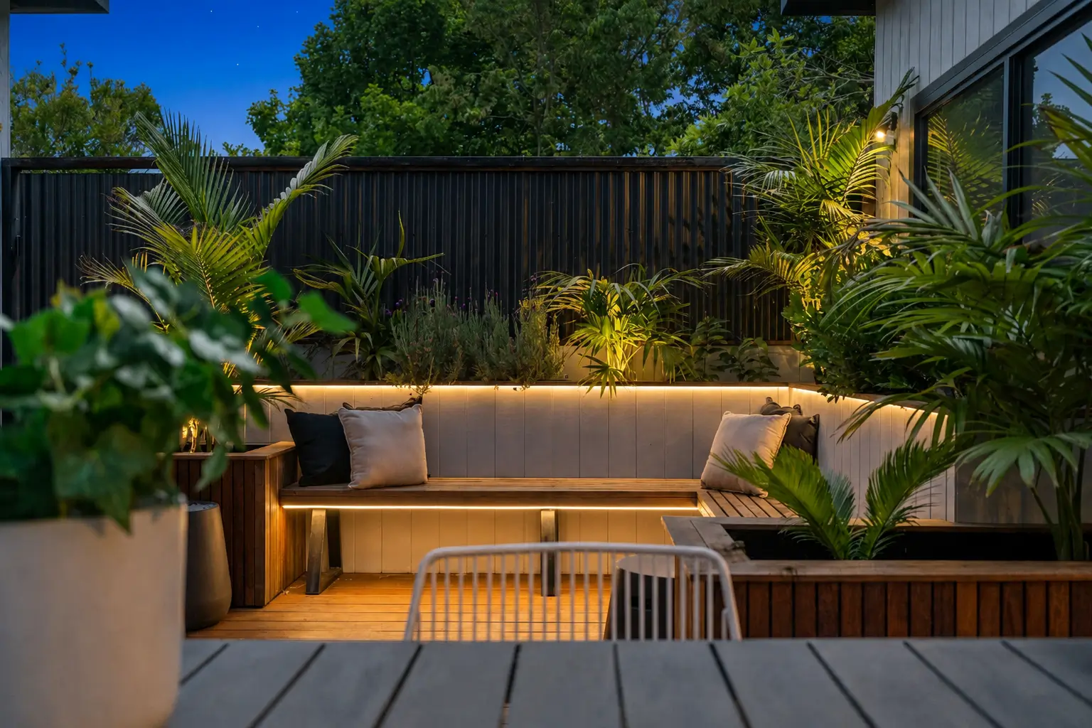 LED strips under the bench and step giving indirect deck lighting